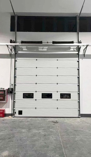 Insulated sectional door for cold storage