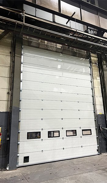 High lift sectional door for workshop