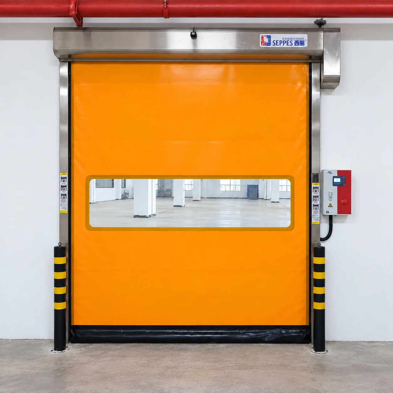 SEPPES orange high speed door with a metal housing, side rails and a wall-mounted control panel