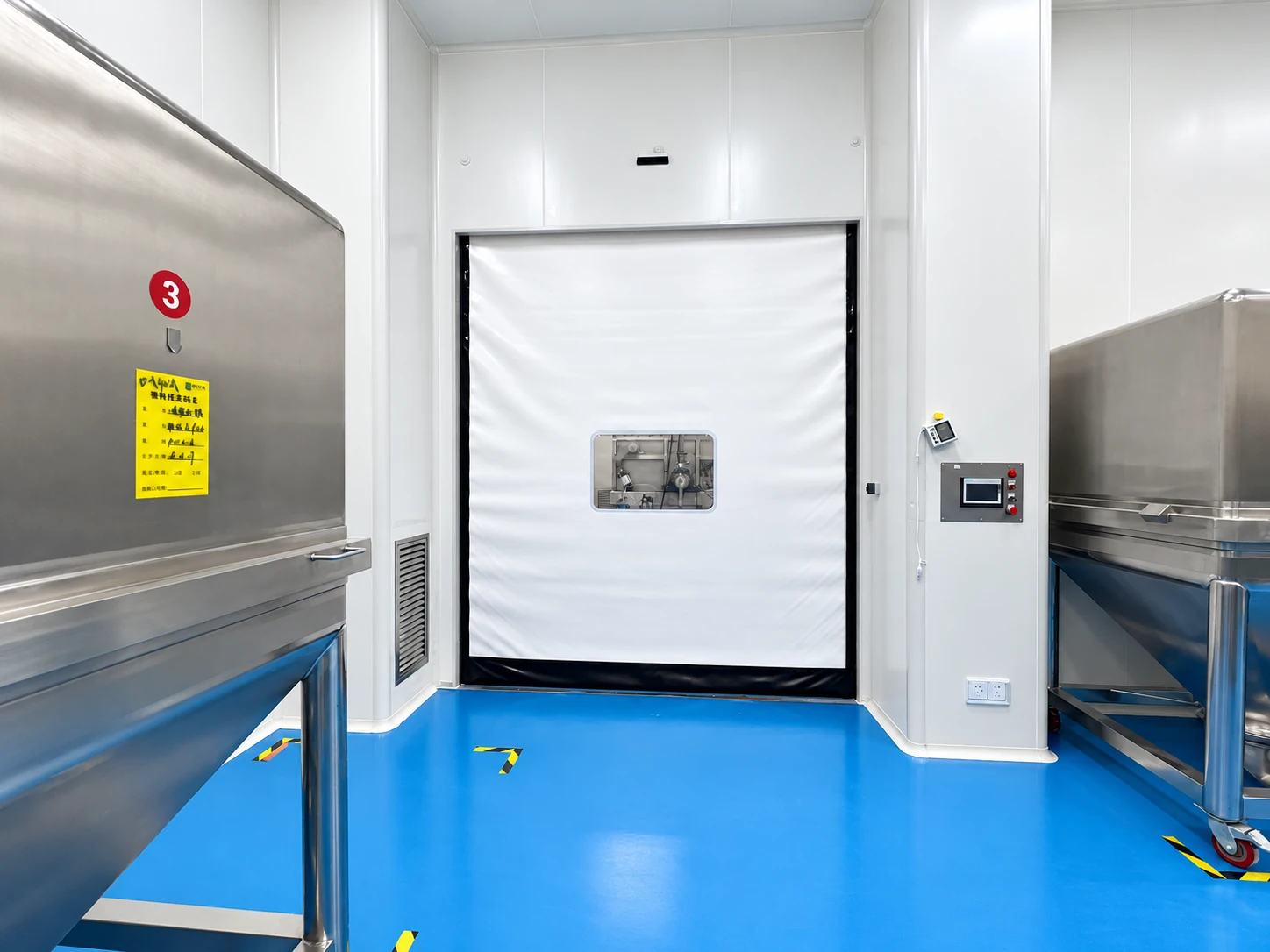 Custom cleanroom door solutions with a white passage door at a pharmaceutical process boundary