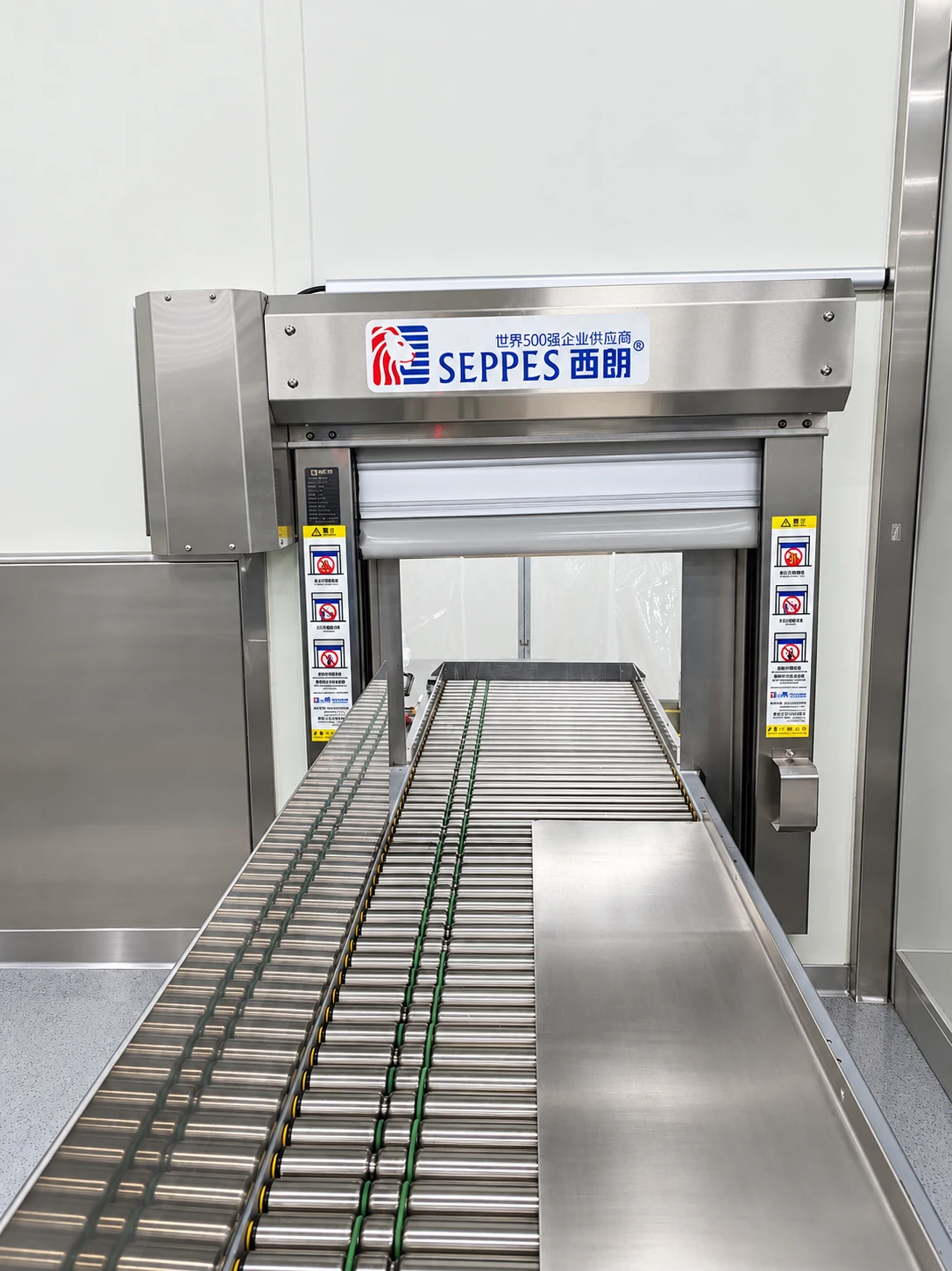 Retouched medical-products cleanroom door opening aligned with a roller conveyor
