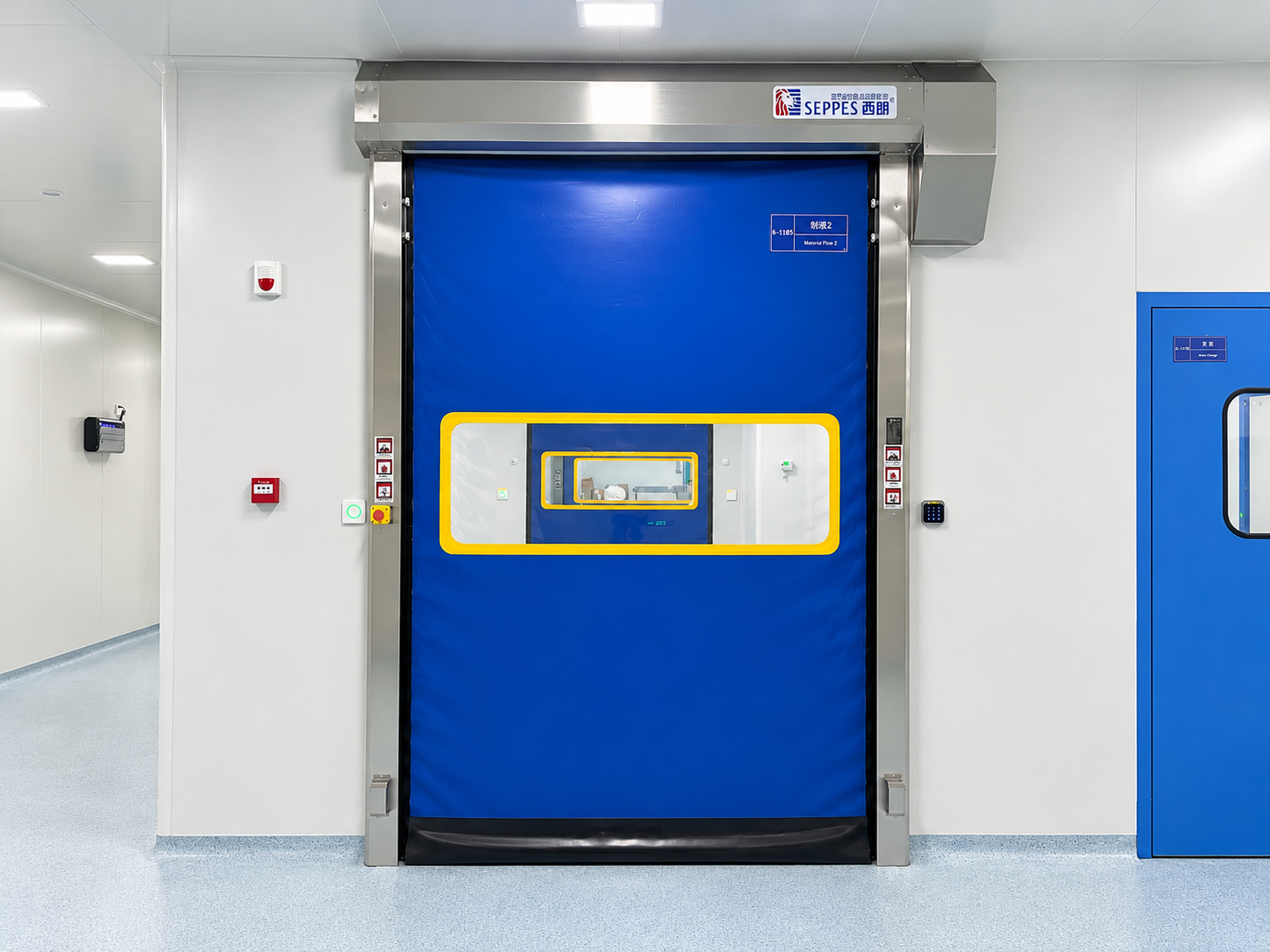 SEPPES cleanroom interlock installation with a blue high speed door and a second door visible through its vision panel