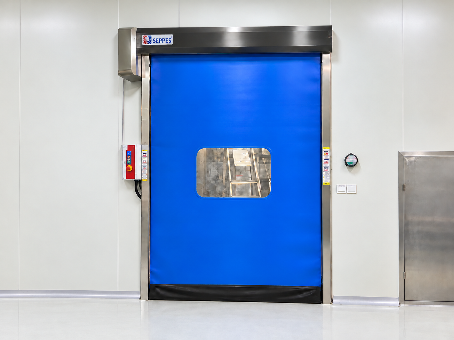 SEPPES cleanroom airtight door with a blue curtain, stainless steel frame and side control box against a white cleanroom wall, retouched installation photograph